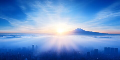 A stunning view of a mountain, likely Mount Fuji, with sunlight illuminating the sky above a cityscape shrouded in clouds. Concept Mount Fuji, Stunning Landscape, Cityscape in Clouds, Sunlit Sky