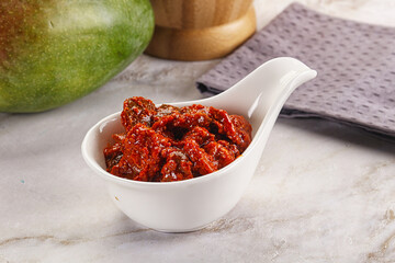 Spicy pickled raw green mango