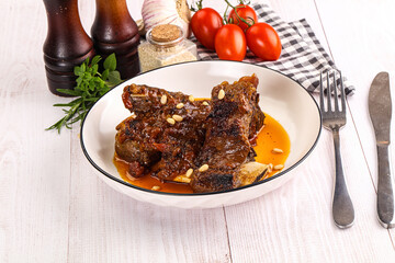 Prepared tasty beef ribs with sauce