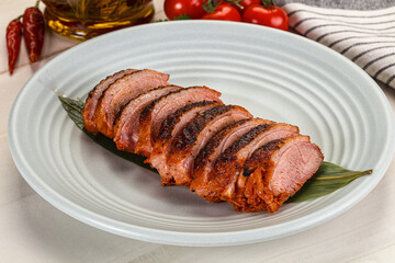 Sliced duck breast baked with cherry