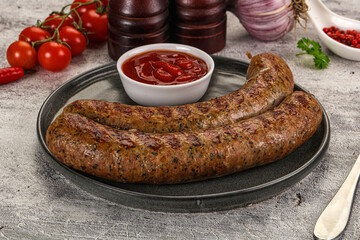 Grilled beef sausages with sauce