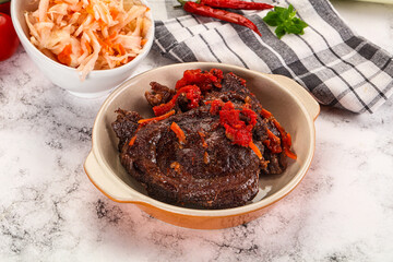 Baked beef cheeks with vegetables