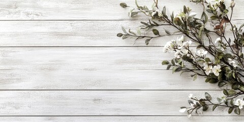 White wooden wall planks background with delicate green leaves and white flowers positioned on the top right, offering a serene natural texture.