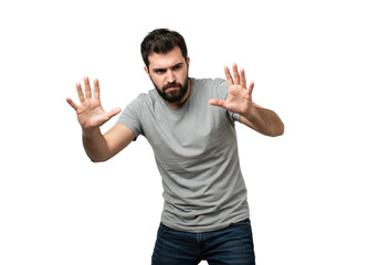 Naklejka premium Serious Man Gesturing Stop Hands Up Grey TShirt Studio Male Fear Adult Human Black Image Photo 