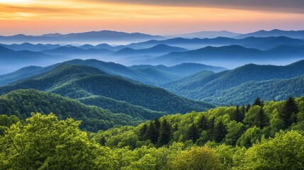 Fototapeta premium A scenic mountain view with layers of misty peaks glowing softly as the sun rises