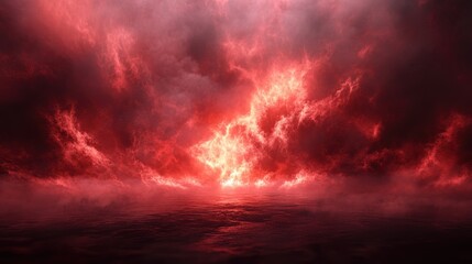 Obraz premium Dramatic red clouds reflect on the ocean surface during a surreal sunset over a calm sea