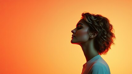 Paper watercolor idea. Silhouette of a contemplative woman against a vibrant orange background.