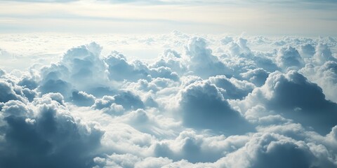 Vast sky filled with fluffy white clouds in varying shades of gray and blue creating a serene and soft background for various uses.