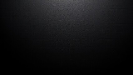 Smooth black leather wall captures light at the top, casting intricate shadows over its textured surface.  