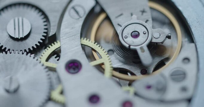 Intricate and elaborate details of mechanical watch finely crafted gears and essential components. Soft focus