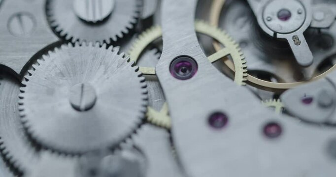 Intricate and elaborate details of mechanical watch finely crafted gears and essential components. Soft focus