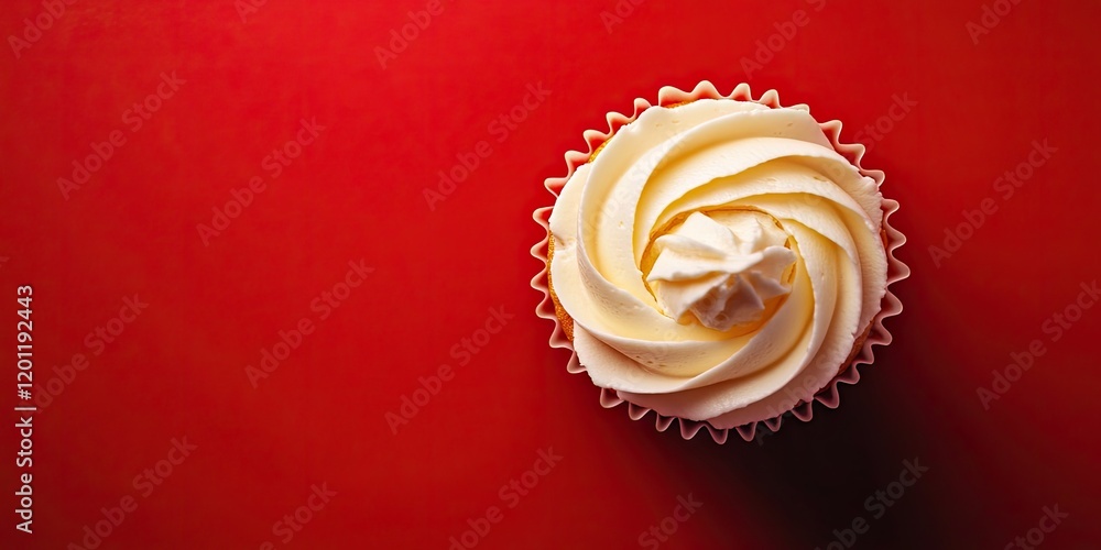 Poster vibrant yellow frosted cupcake on a deep red background viewed from above creating a striking visual