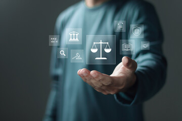 Legal consultant and lawyer concept. Person holding virtual icons of law legal justice. Legal advice in Labor law for a business company legal.