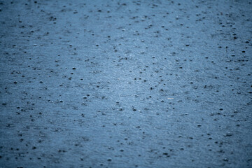 Rain. Raining time. Falling raindrops. Water background. Water surface. Water surface background. Raindrops background. Water drop splash. Raining outside.