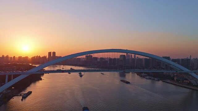 4K Real Time Aerial view of Lupu bridge and Huangpu River in Shanghai at sunset, China