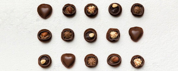 Different kinds of chocolates on colored table close-up. Top View and Flat Lay