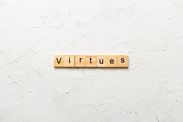 virtues word written on wood block. virtues text on cement table for your desing, concept