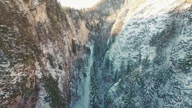 FPV drone flight into Zarnesti Gorges, capturing stunning winter landscapes, forested cliffs, and serene Carpathian beauty