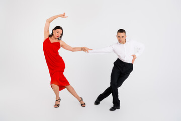 Full size photo of two young passionate partners hold hands dance isolated on white color background