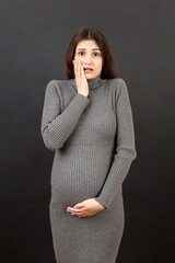 Stressed or angry pregnant woman. Pregnancy mother problems on colored background isolated