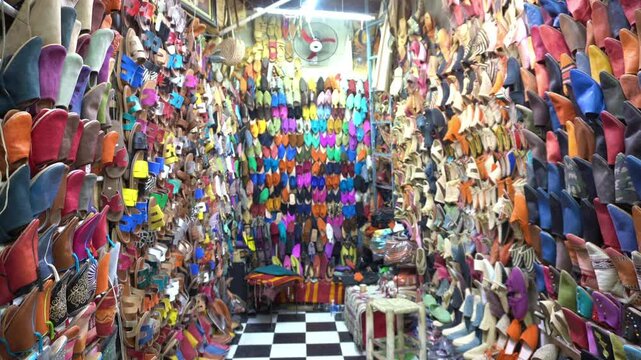 Africa, Morocco, Marrakech 12,29,2024 walking in the traditional suk, souk market inside the Medina in Jemaa el fna square heritage world , tourist attraction destination , 
leather slippers and shoes