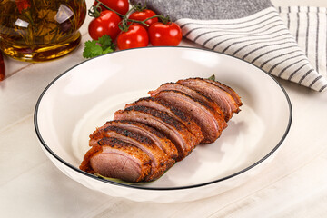 Sliced duck breast baked with cherry