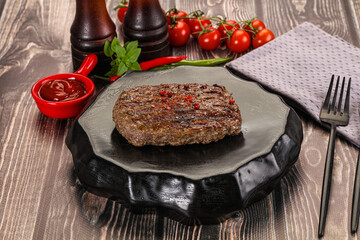 Grilled beef burger cutlet with sauce