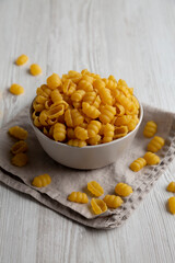 Homemade Dry Raw Gnocchi Pasta in a Bowl, side view.