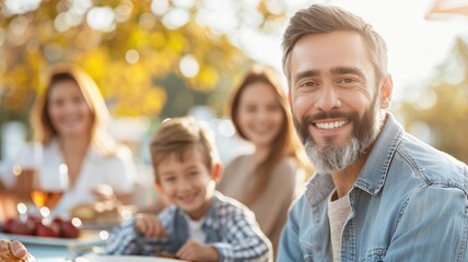 Obraz premium A happy family enjoying a meal outdoors in a sunny setting, with smiles and a sense of togetherness.