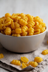 Homemade Dry Raw Gnocchi Pasta in a Bowl, low angle view.