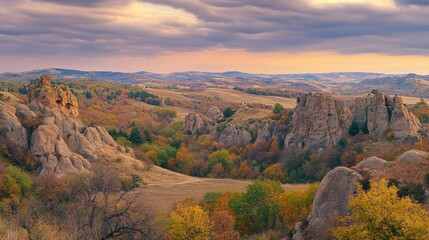 Autumnal Mountain Majesty: A Breathtaking View of Colorful Foliage and Majestic Rock Formations