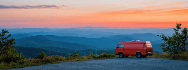 Fototapeta premium Orange van parked at a scenic mountain overlook during sunset, with vibrant skies and lush greenery creating a tranquil atmosphere.