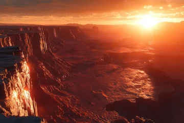 Sun setting over a canyon in the desert landscape