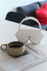 Morning Coffee, Headphones, and Newspaper in a Modern Kitchen