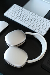 2025 Modern Headphones and Keyboard on a Workspace Desk
