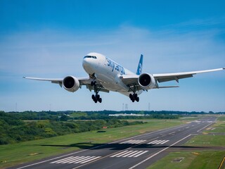 Obraz premium Commercial Airplane Taking Off from a Runway Against a Clear Sky