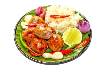 Delicious with food Thailand with menu fried sausage with sticky rice served on banana leaves with chili onions and lemon slices put on white background in isolated concept.