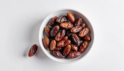 Obraz premium Top View of a Bowl of Fresh Dates on a Clean White Surface Background