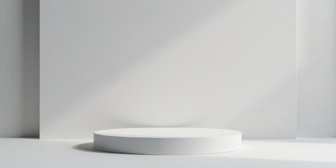Simple White Cylindrical Display Platform Against a Plain White Wall with Subtle Light and Shadow