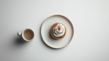 A cinnamon roll and coffee on a white background