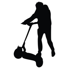 Young boy rides a battery-powered scooter