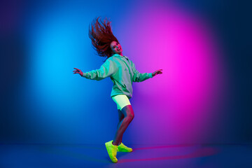 Full length photo of carefree attractive lady dressed green sweatshirt enjoying disco empty space isolated blue light color background
