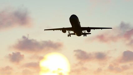 ULTRA HD. Airplane flies in sunset sky. Travel. Airplane takes off against the background of sunset sky.	

