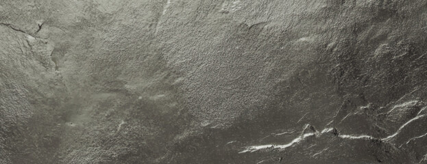 Naklejka premium Gray stone background with a rough texture. The background features a natural, uneven surface with gray tones throughout. Textured stone background vector. Gray background.