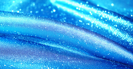 スカイブルーの平らな生地にキラキラのラメを施した背景