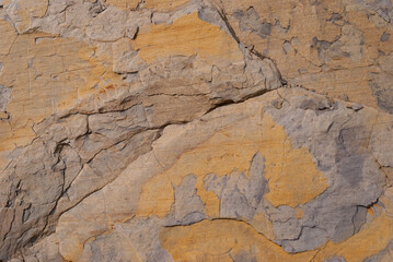 Layered rock with red veins in the Swiss Alps as background