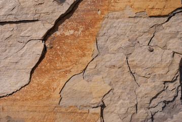 Layered rock with red veins in the Swiss Alps as background