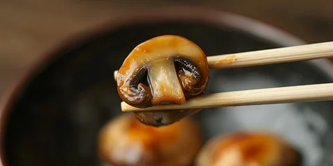 Close-up of Sauteed Mushrooms with Chopsticks - Delicious Asian Cuisine