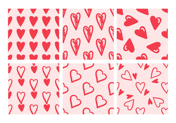 Set of seamless patterns with red hearts on pink background in doodle style