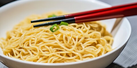 Close-up of Noodles in a Bowl with Chopsticks